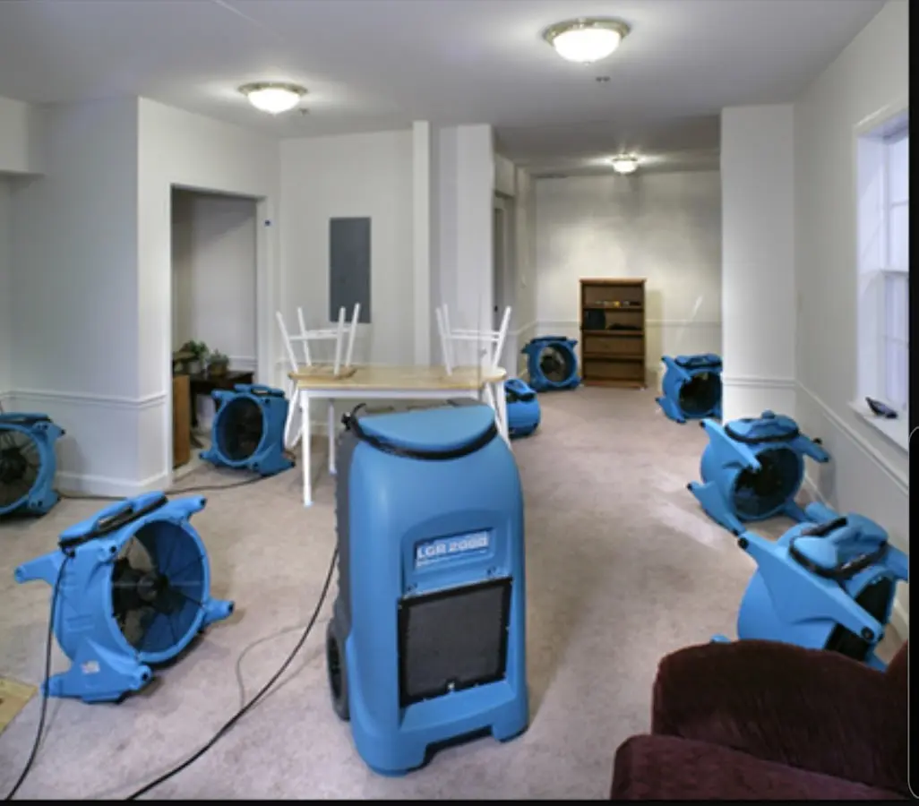 Air movers and dehumidifier setup for Water Damage Restoration in South Ogden